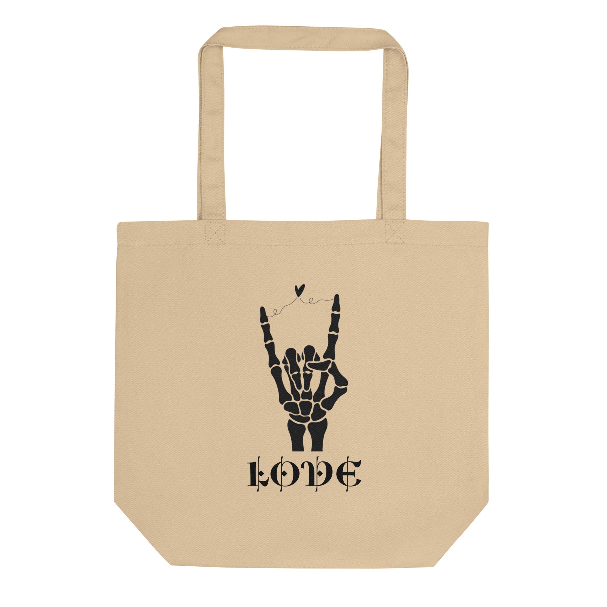 Un tote bag en toile de couleur beige naturel présentant une illustration noire centrée. Le dessin représente une main de squelette faisant le signe des cornes (rock on) avec un petit cœur flottant au-dessus des doigts. En dessous, le mot "LOVE" est inscrit dans une police de caractères stylisée, médiévale et gothique.