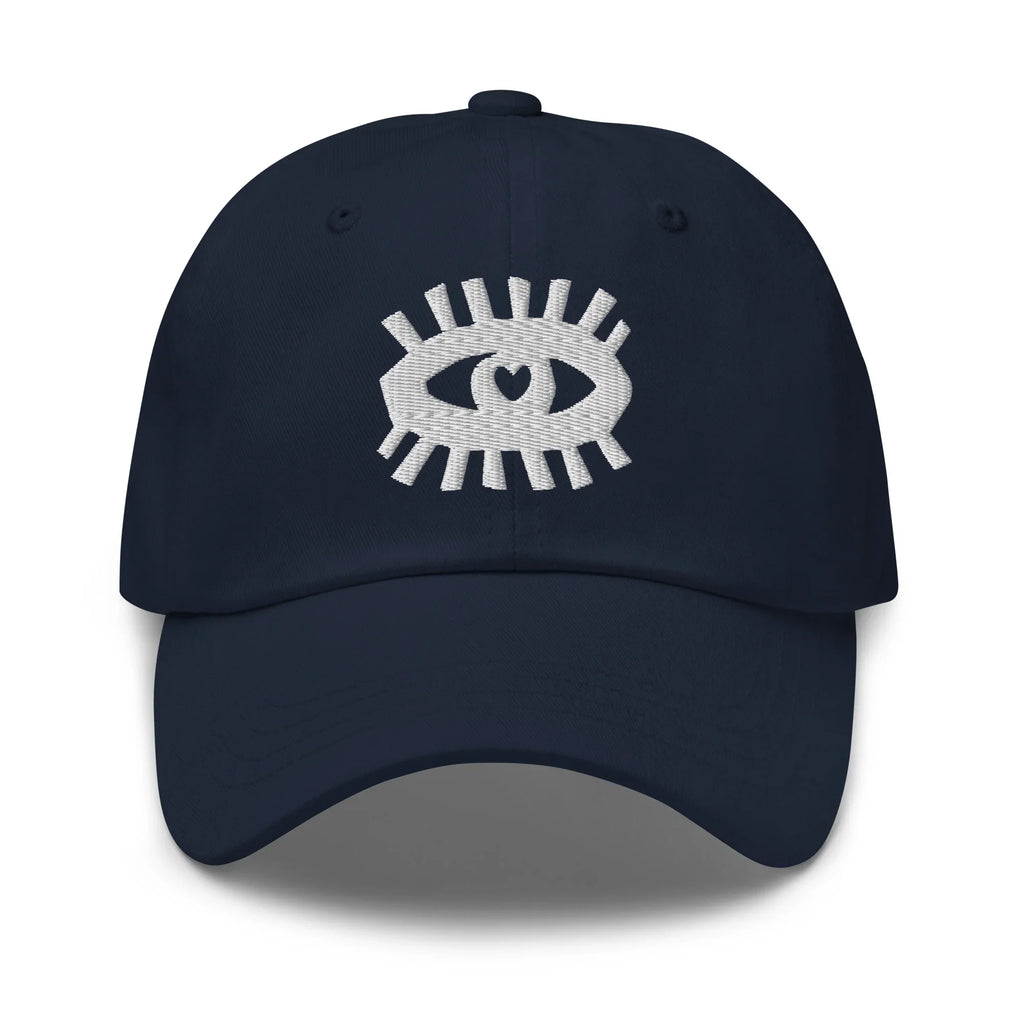 Casquette classique bleu marine avec motif œil brodé blanc original sur le devant.