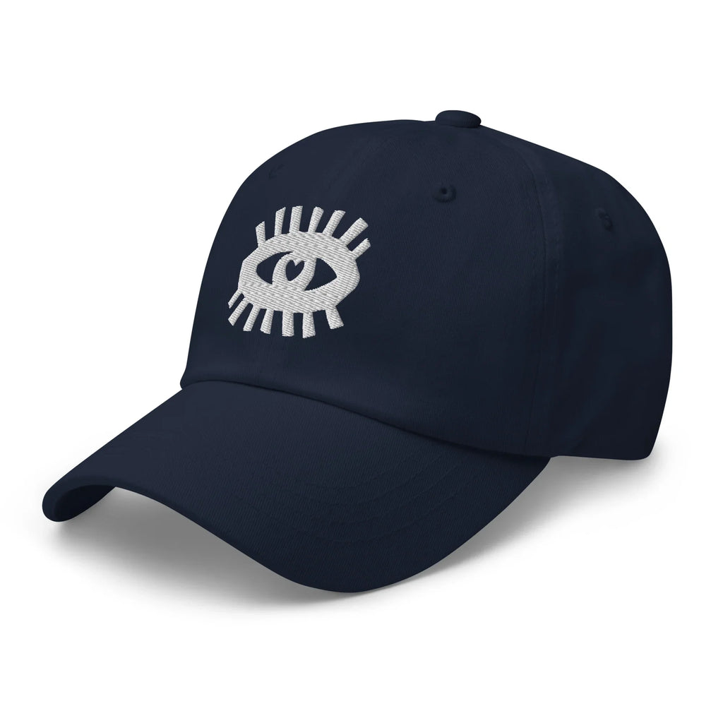 Casquette bleu marine avec broderie œil blanc minimaliste sur le devant, style classique